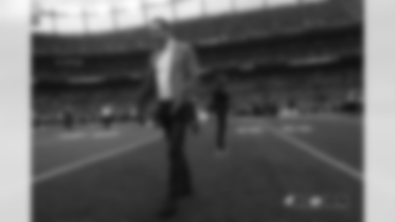 Peyton Manning walks off the field during pregame warmups before the game against the Kansas City Chiefs at Broncos Stadium at Mile High on October 1, 2018.