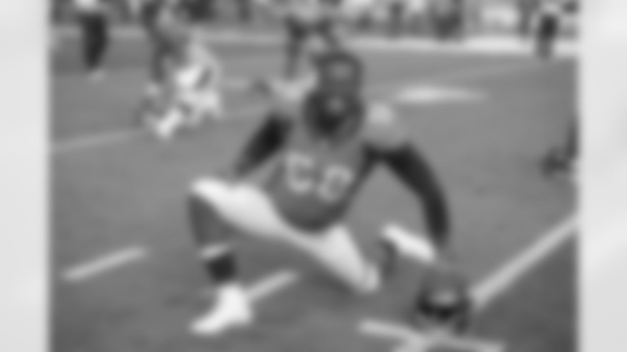 Denver Broncos linebacker Von Miller (58) smiles as he stretches during warm ups before the NFL game against the St. Louis Rams at Sports Authority Field in Denver, CO
August 24, 2013.