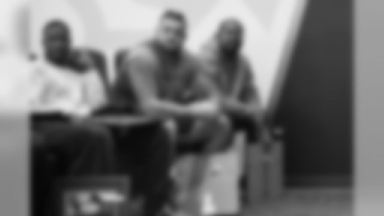 Will Parks, Dalton Risner and Von Miller at a team meeting where the Denver Broncos Community Development department announced and recognized 2019 community champion award winners on December 12, 2019. (Photo by Ben Swanson)