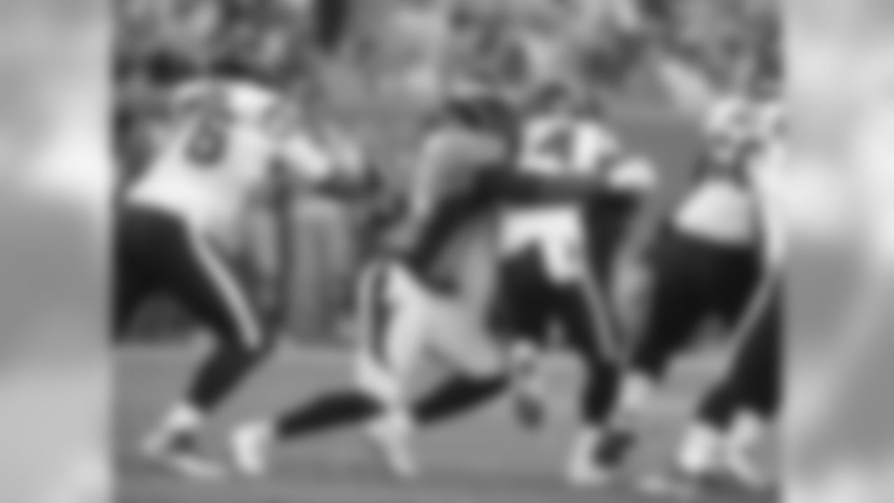 Denver Broncos defensive end DeMarcus Ware (94) brings down Texans runningback Alfred Blue (44).