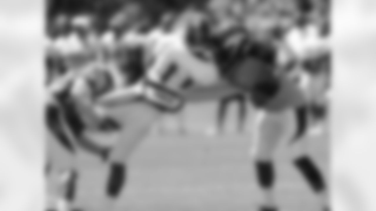 Holliday meets a pair of defenders after a red-zone catch.