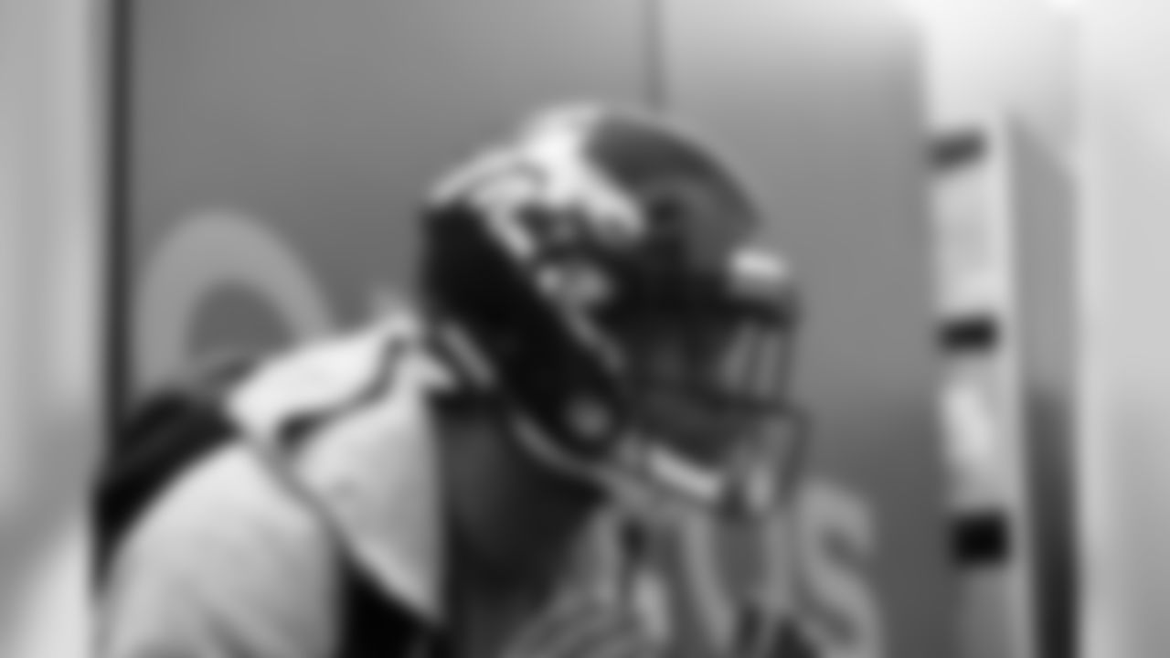 Running back David Williams tries on a helmet at UCHealth Training Center.
Photo: Ryan Young