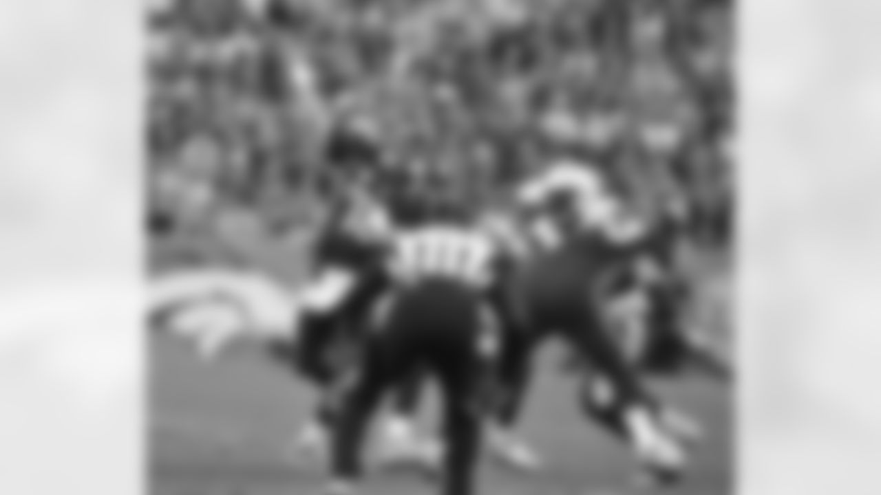 Manning fires a pass downfield during the first half.