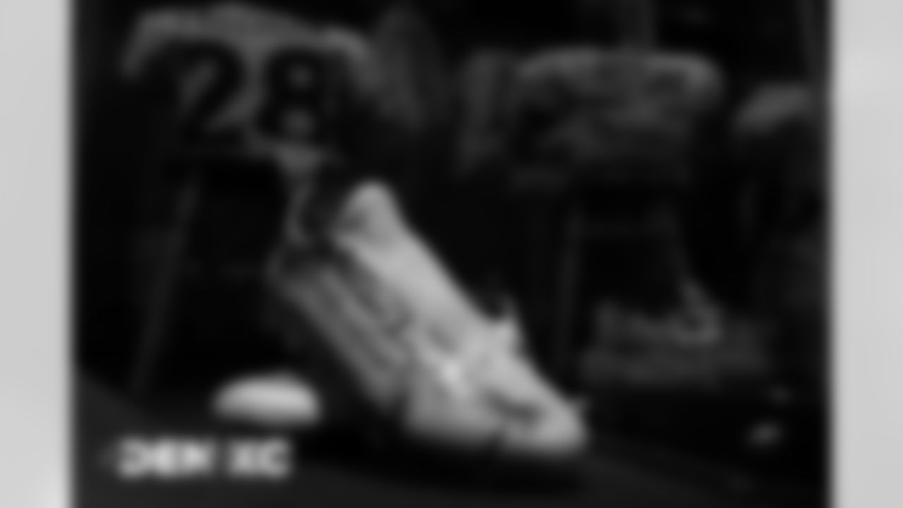 Royce Freeman's custom cleats for My Cause My Cleats in the locker room before the Broncos' Week 13 game against the Kansas City Chiefs at Arrowhead Stadium in Kansas City, Missouri. (Photo by Gabriel Christus)