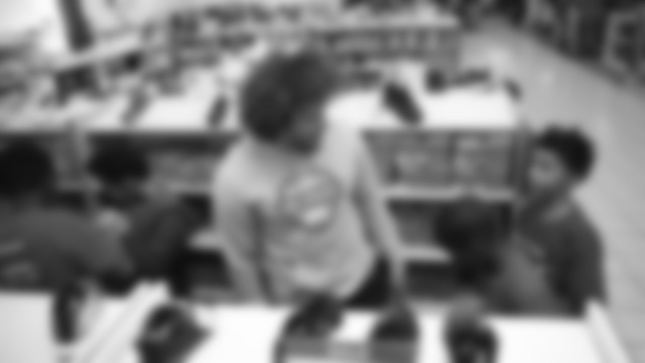 Phillip Lindsay surprises children from the Denver Broncos Boys & Girls Club with a shopping spree at a department store on December 2, 2019. (Photo by Ben Swanson)