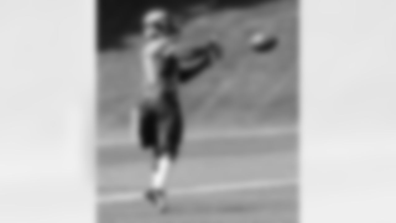 RB Ronnie Hillman looks in a catch during the first drill of practice.
