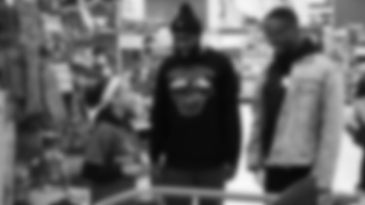 Darian Stewart and Will Parks talk with a participant during Will Parks' shopping spree for the Boys & Girls Club of Metro Denver on Dec. 3, 2018
