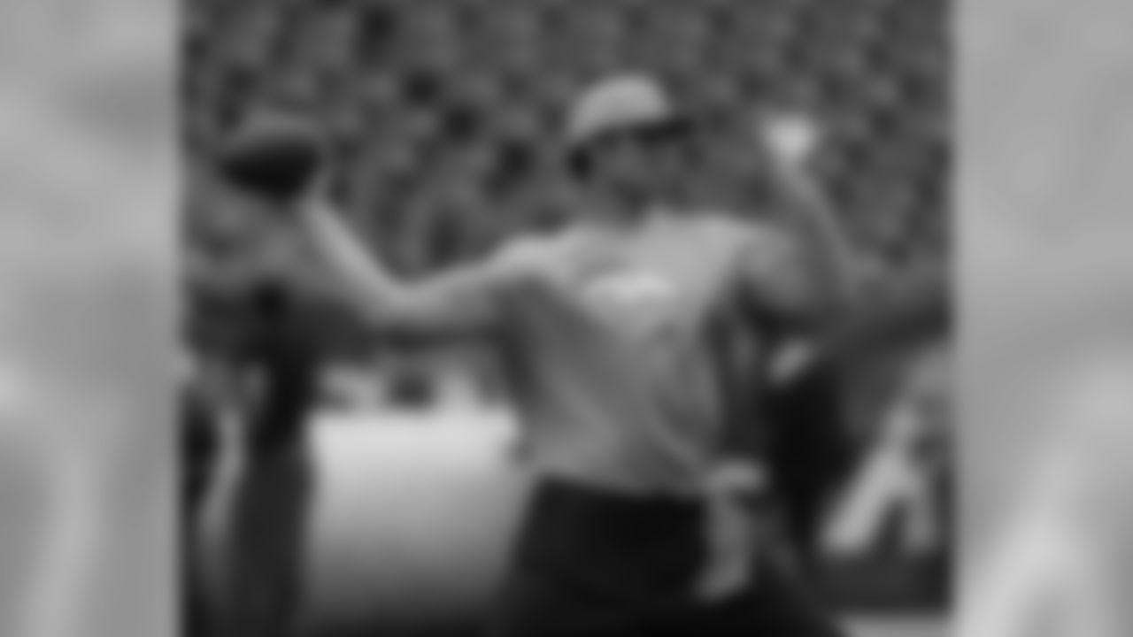 QB Brock Osweiler gets his arm ready while warming up prior to kickoff.