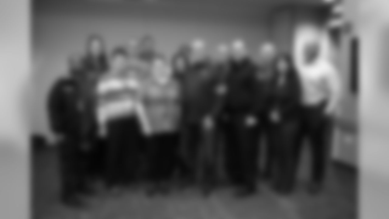 Head Coach Vic Fangio takes a group photo with staff members during Fangio's visit to the Arapahoe County Sheriff's Office as part of Random Acts of Kindness Week on February 20, 2020 in Centennial, Colorado. (Photo by Ben Swanson/DenverBroncos.com)