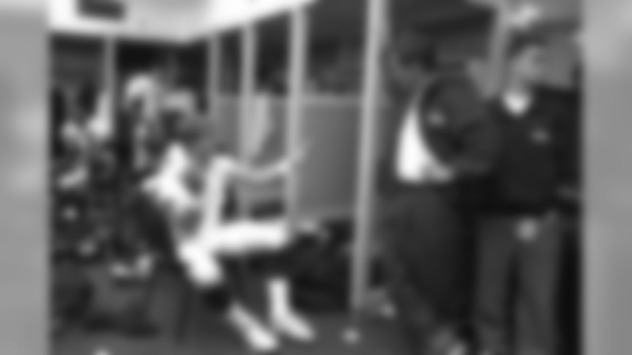 John Elway and Mike Shanahan discuss strategy in the locker room after a game against the San Diego Chargers at Jack Murphy Stadium in San Diego, CA on November 30, 1997.