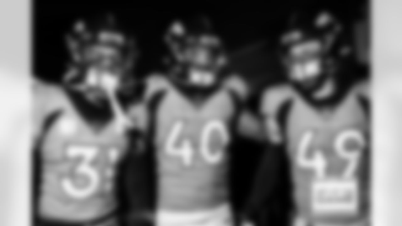 Denver Broncos safety Justin Simmons (31), linebacker Justin Strnad (40) and linebacker Alex Singleton (49) in the tunnel during team introductions before the Broncos' Week 8 game against the Kansas City Chiefs at Empower Field at Mile High in Denver, Colorado on October 29, 2023. Photo by Ben Swanson / Denver Broncos