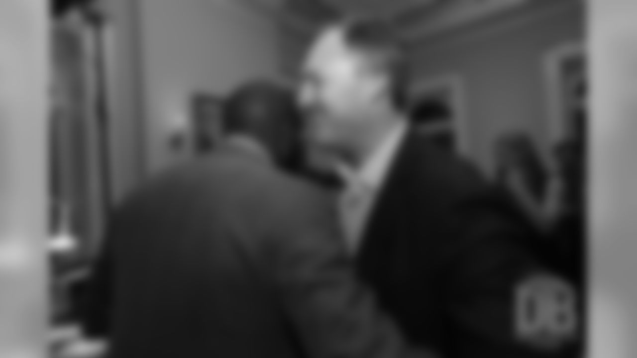 John Lynch greets Champ Bailey at the Pro Football Hall of Fame's Celebration of Excellence Reception in Atlanta on January 31, 2019.