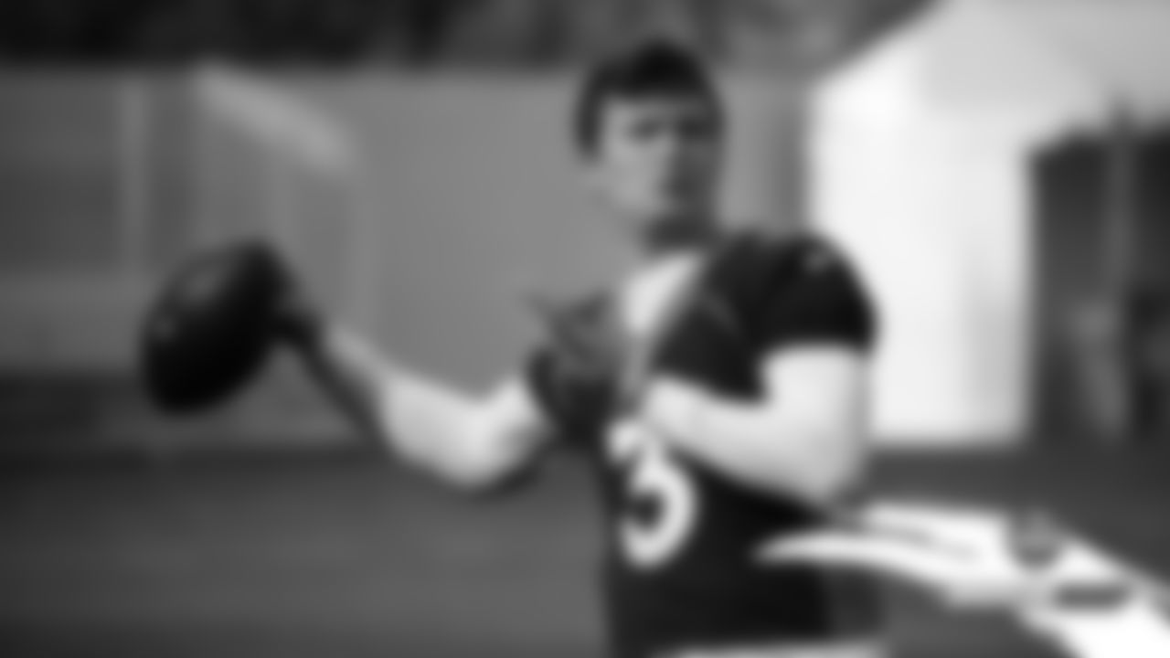 Drew Lock warms up before practice on Day 11 of training camp on July 30, 2019.