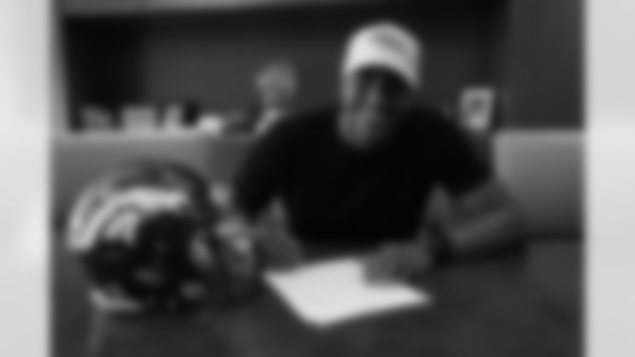 Courtland Sutton signs his rookie contract on May 10, 2018.