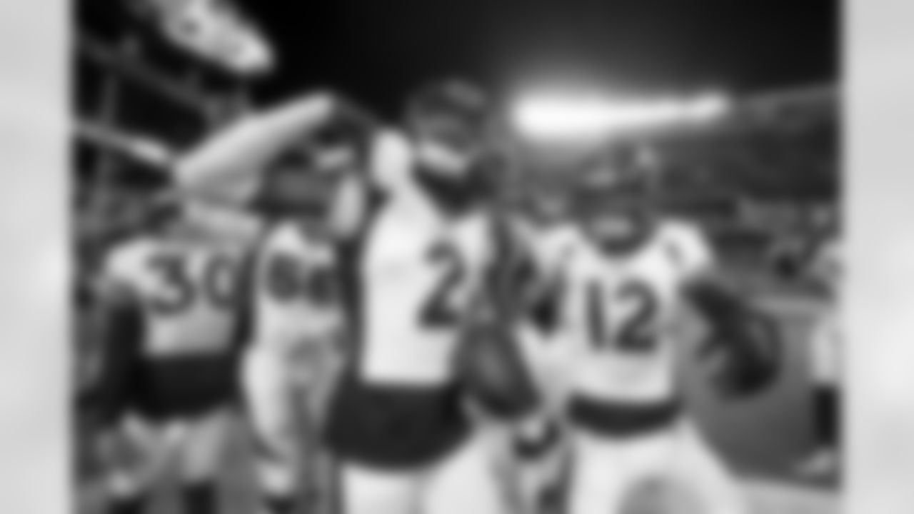 Pat Surtain II and Mike Ford during the Broncos' Week 13 game against the Kansas City Chiefs at GEHA Field at Arrowhead Stadium in Kansas City, Missouri on December 5, 2021. (Photo by Gabriel Christus)