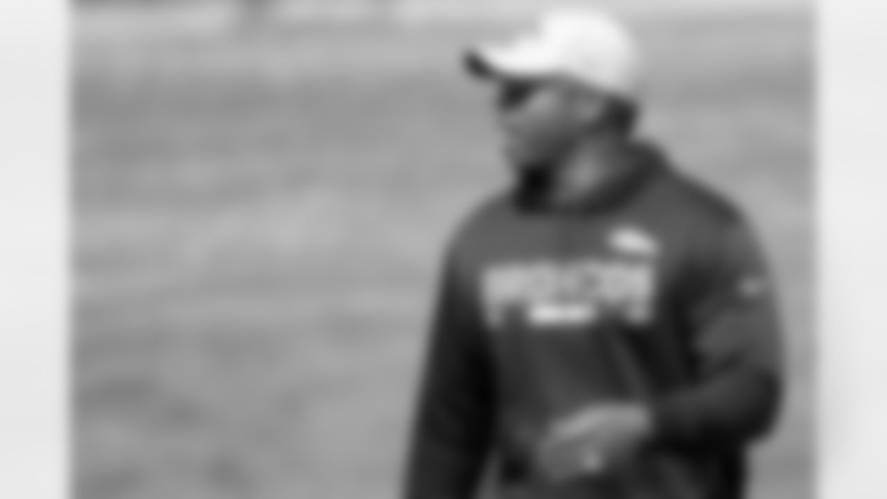 Head Coach Vance Joseph instructs a player during on-field work during Phase II of the offseason program.