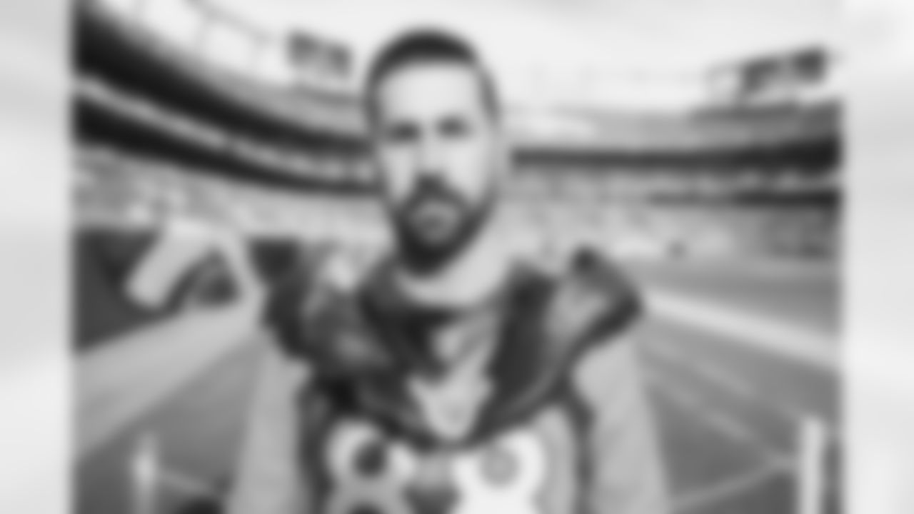 Brandon McManus with Demaryius Thomas cleats before the Broncos' Week 14 game against the Detroit Lions at Empower Field at Mile High in Denver, Colorado on December 12, 2021. (Photo by Joe Abdellah)
