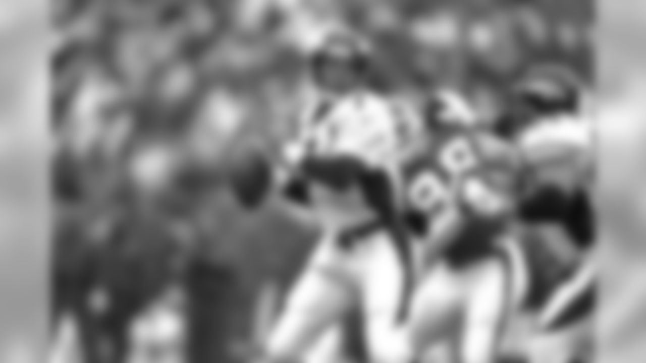 Buffalo: John Elway drops back to pass against the Buffalo Bills at Rich Stadium in Orchard Park, NY on October 26, 1997.