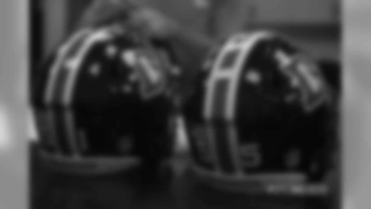 Inside the Broncos' equipment room as staffers transition helmets to the team's Color Rush set, applying new decals and throwback logos for the team's Week 12 game.