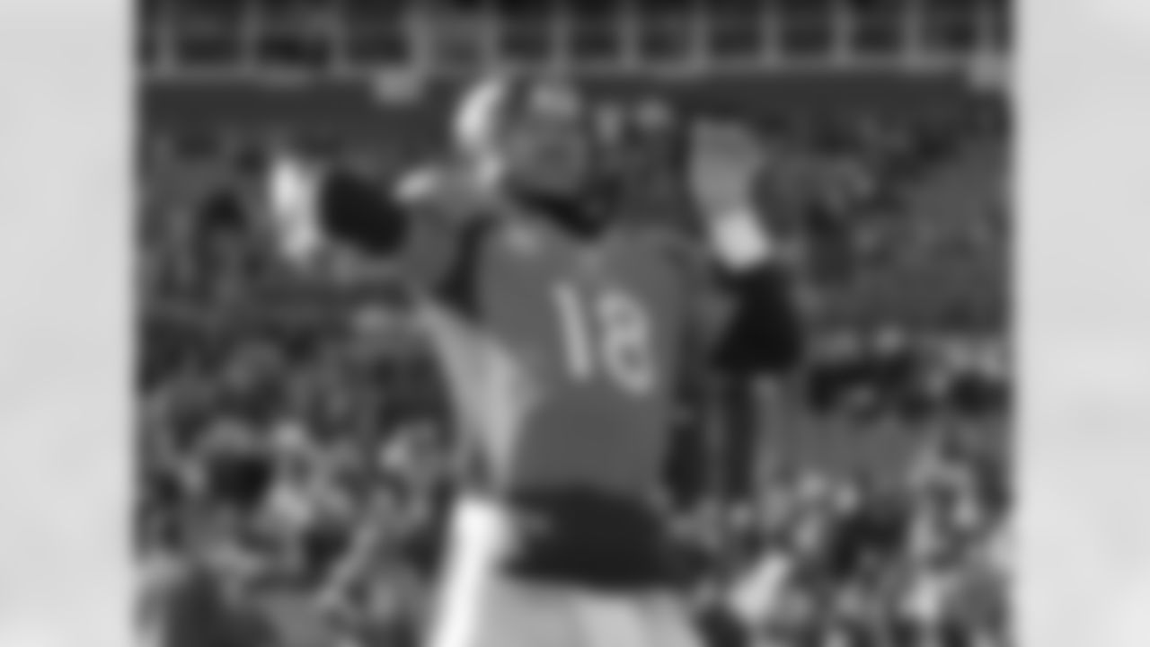 Manning throws a pass during pregame warmups.