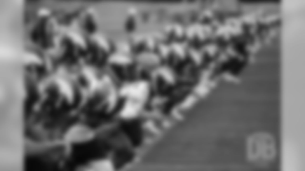 Players do conditioning during the Broncos' second mandatory minicamp practice on June 5, 2019.