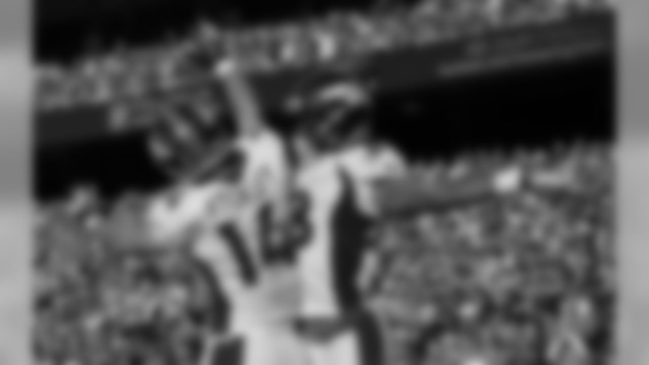 WR Demaryius Thomas celebrates his touchdown reception with fellow WR Brandon Stokley.