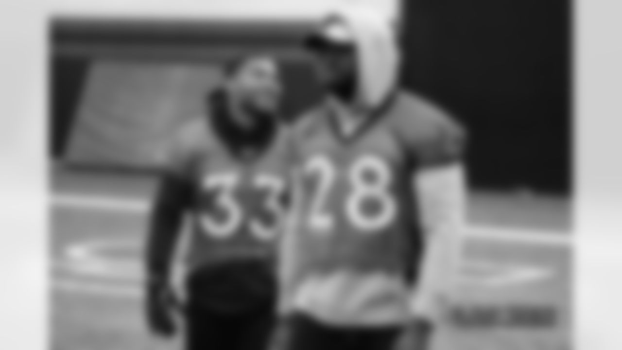 Khalfani Muhammad (left) and Royce Freeman during a team walkthrough at UCHealth Training Center on Dec. 29, 2018 ahead of their Week 17 game against the Chargers.