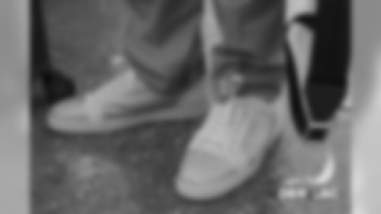 Domata Peko Sr.'s shoes as he walks on the tarmac at Signature Flight Support in Denver, Colorado, November 17, 2018.
Photo by Gabriel Christus