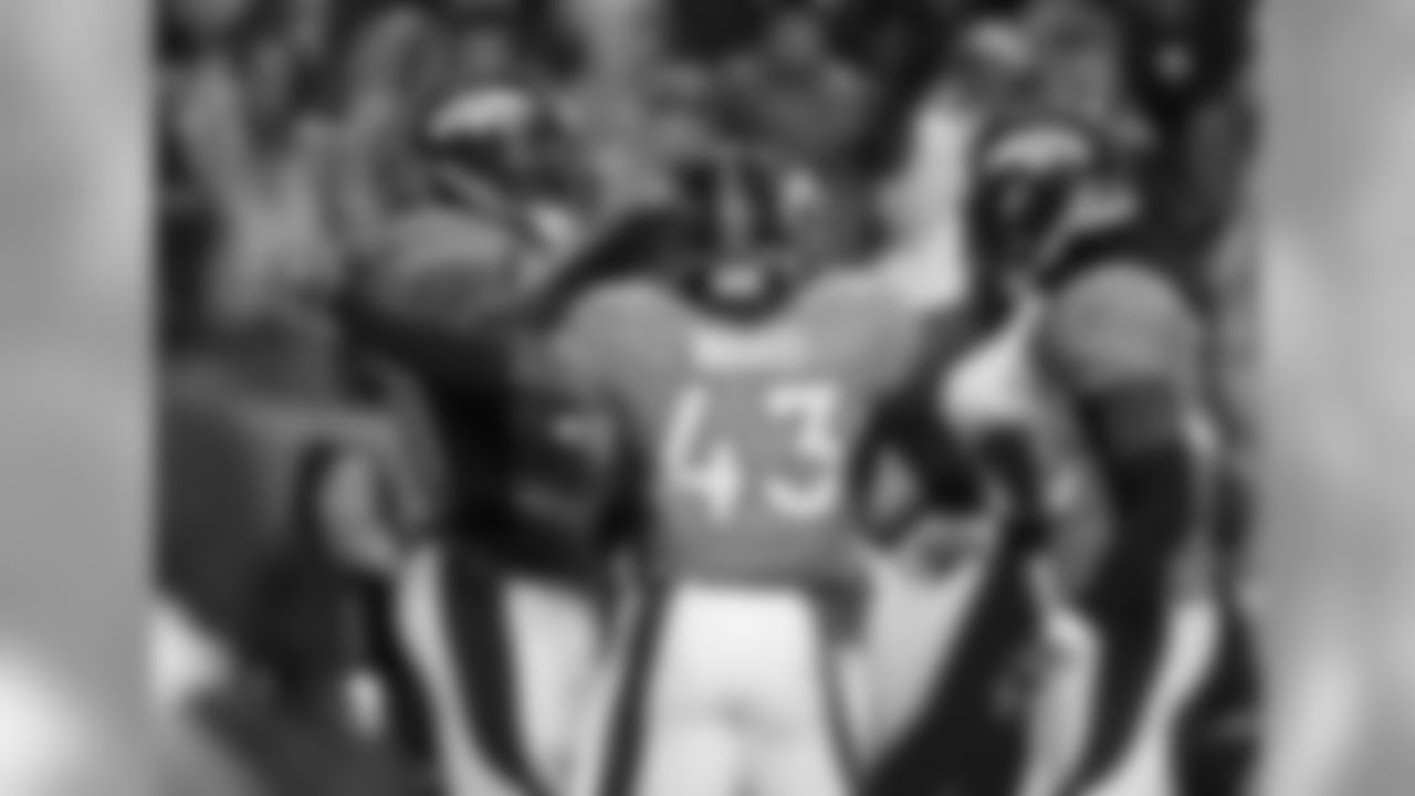 Malik Jackson, T.J. Ward and Quinton Carter