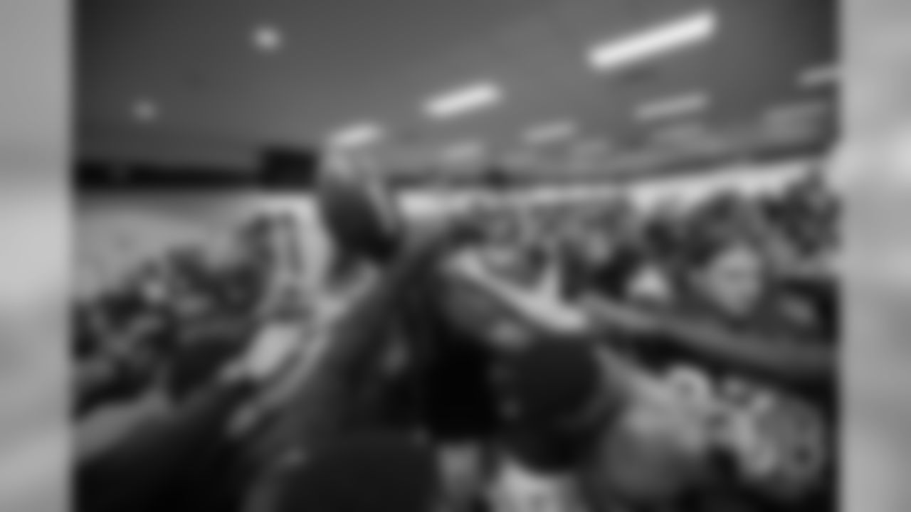 December 10
Demaryius Thomas bows his head as the team gathers around him in the locker room after the Broncos' win over the Jets.