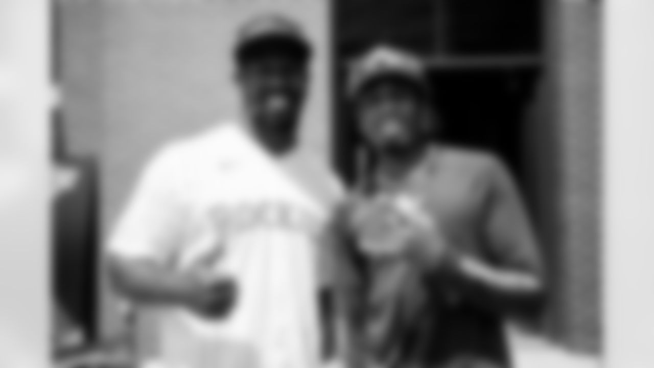 Von Miller poses for a photo with Quavo during batting practice and participant introductions at the Rally Hotel before the 2021 MLB All-Star Celebrity Softball Game on July 11, 2021. (Photo by Ben Swanson)