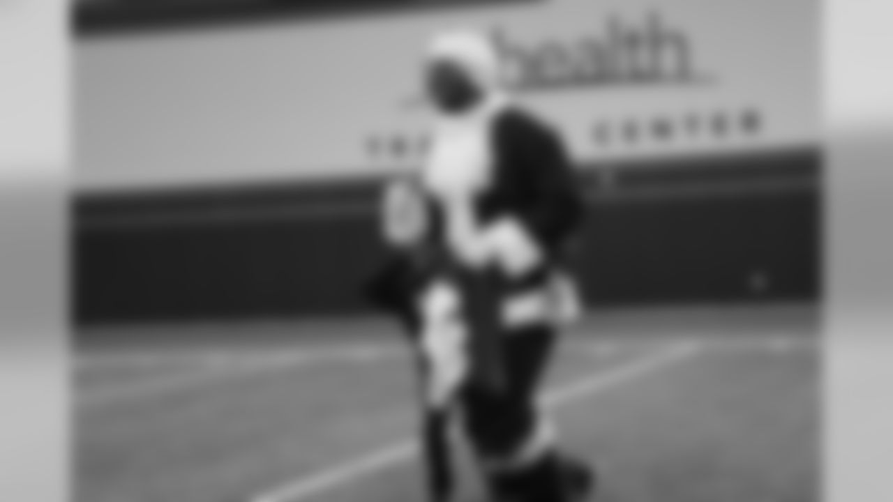 Von Miller, dressed as Santa Claus, walks away after his beard was pulled down at the Broncos' Boys & Girls Club holiday party for about 200 children from the Boys & Girls Clubs of Metro Denver at UCHealth Training Center on December 17, 2018.