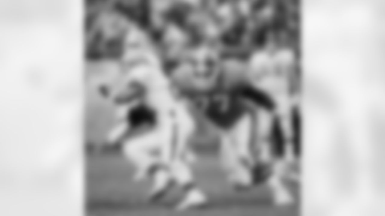 Linebacker Karl Mecklenburg prepares to wrap up a Browns ball carrier during an October 30, 1994 win against Cleveland.