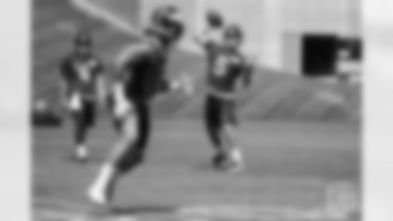 quarterback Nick Stevens (5) throws a pass to running back Phillip Lindsay (2) during the 10th and final day of OTAs on June 7, 2018 at UCHealth Training Center.