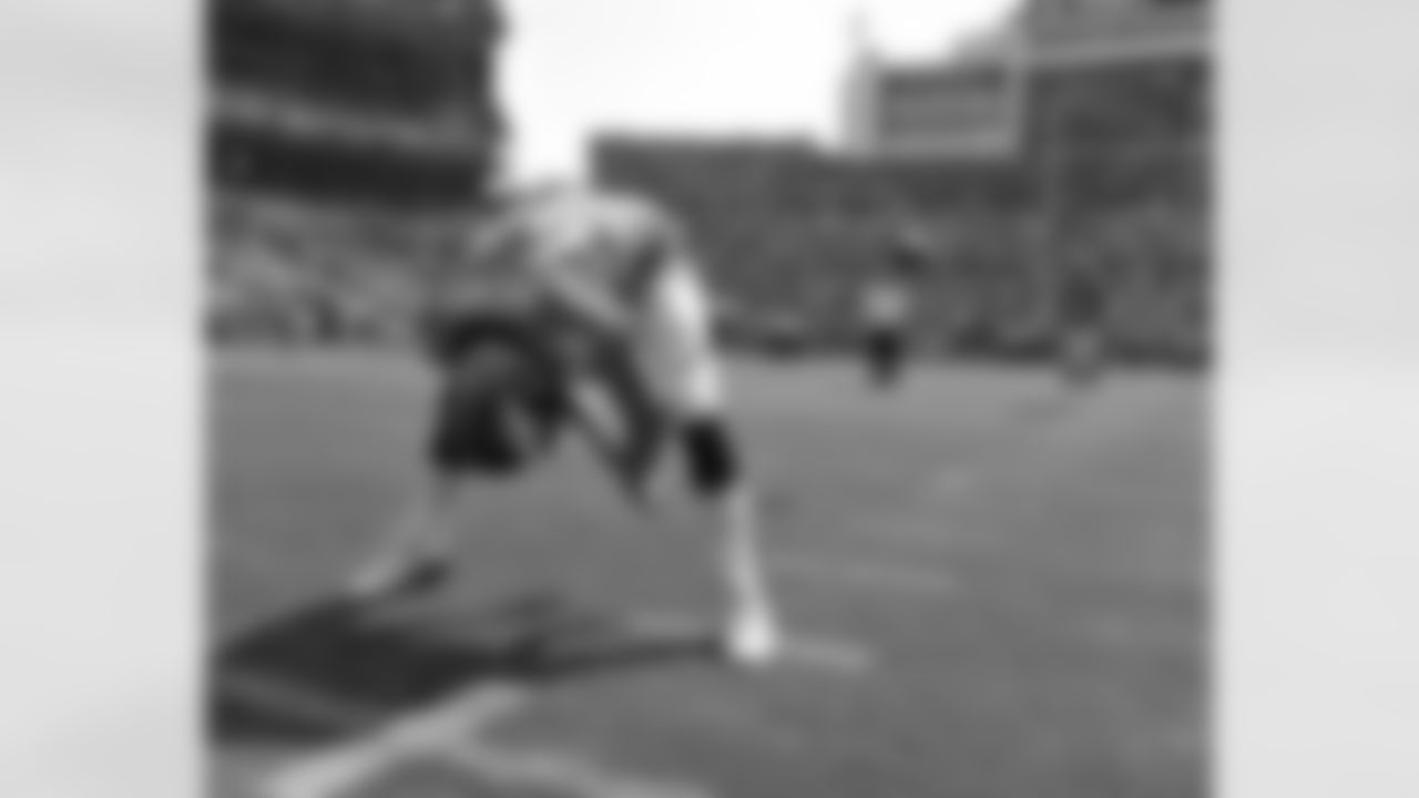 Rookie LS Aaron Brewer sends a spiral towards P Britton Colquitt during pregame preparations.