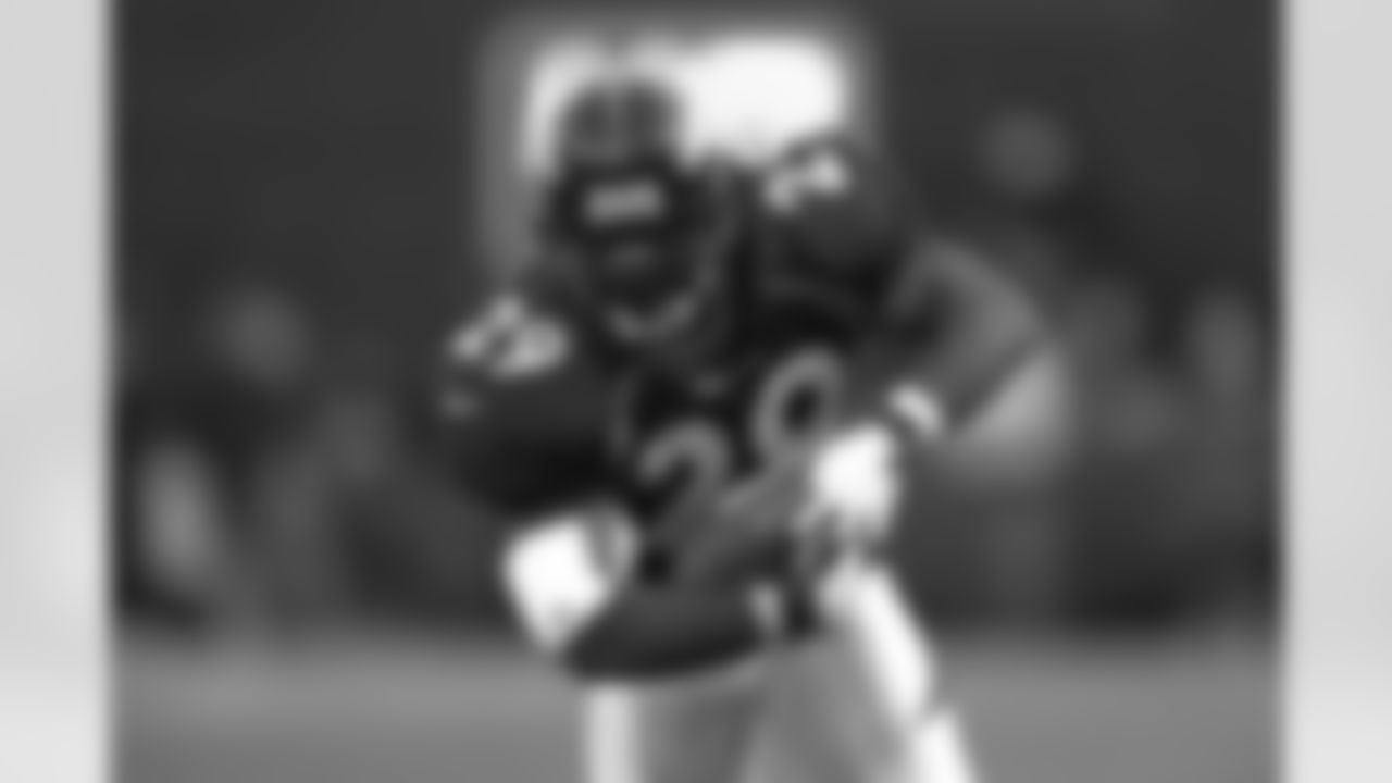 Denver: Howard Griffith advances the ball upfield during the first round wild card game against the Jacksonville Jaguars at Mile High Stadium in Denver, CO on December 27, 1997.