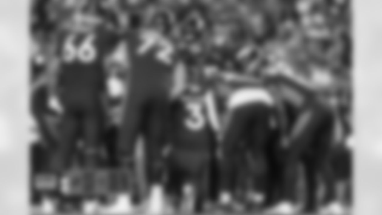 Dalton Risner, Garett Bolles, Russell Wilson, Melvin Gordon III, Montrell Washington and the offense huddle up during the Broncos' Week 3 game against the San Francisco 49ers at Empower Field at Mile High in Denver, Colorado on September 25, 2022. (Photo by Gabriel Christus)