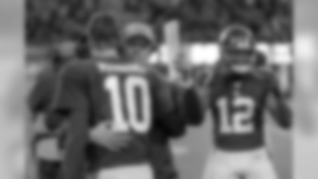 New York Giants head coach Pat Shurmur hugs quarterback Eli Manning (10) during the fourth quarter of an NFL football game against the Miami Dolphins, Sunday, Dec. 15, 2019, in East Rutherford, N.J. (AP Photo/Seth Wenig)