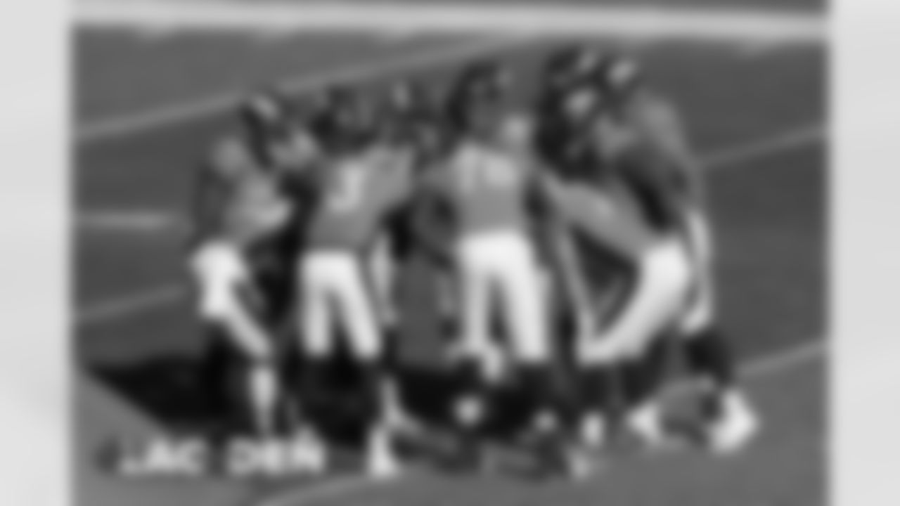 Drew Lock and the offense huddle up during the first half of the Broncos' Week 8 game against the Los Angeles Chargers at Empower Field at Mile High on November 1, 2020. (Photo by Gabriel Christus)