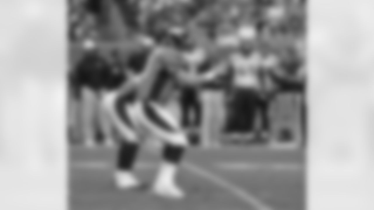 Manning takes the snap.
