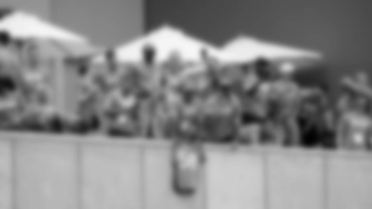 Military members watch practice after the USAA Salute to Service NFL Boot Camp during practice on August 21, 2019 at UCHealth Training Center.