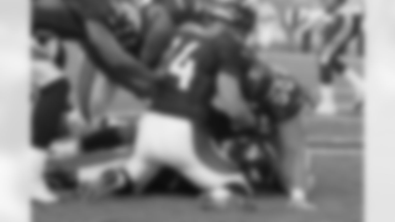 Denver Broncos teammates swarm Edie Royal after he scores a two point conversion to give Denver the lead with 29 seconds remaining in the game against the San Diego Chargers at Invesco Field September 14, 2008