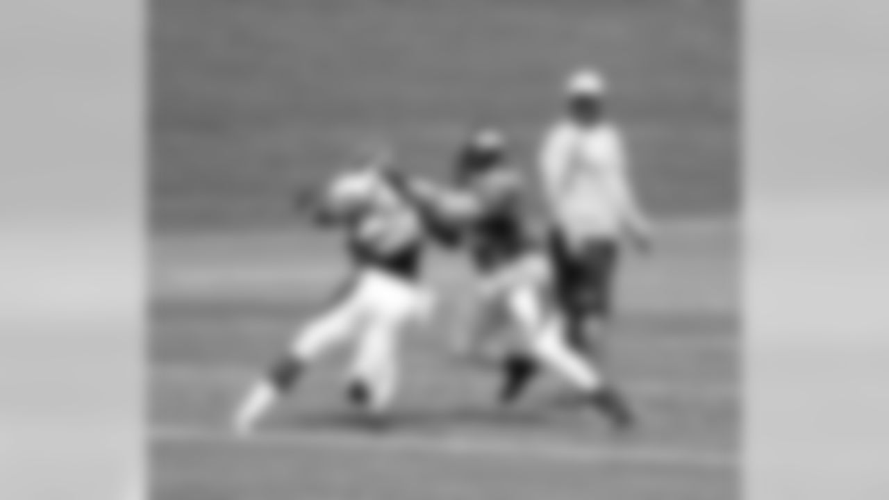 S Charles Mitchell and RB C.J. Anderson