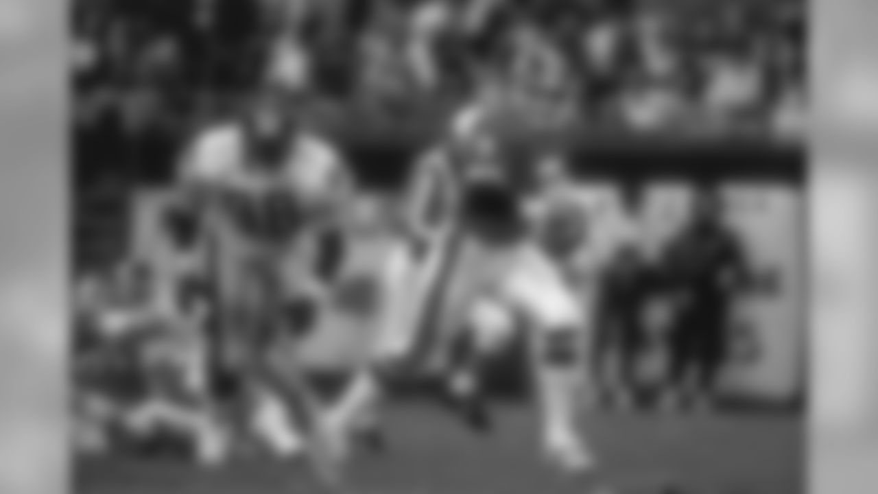 John Elway scrambles during the game against the Pittsburgh Steelers on November 21, 1993.