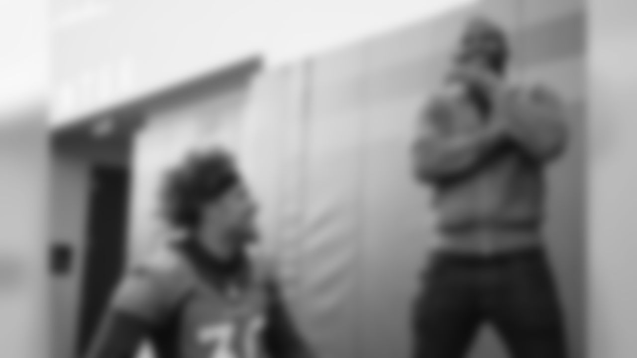 Phillip Lindsay talks with Pro Football Hall of Fame and Broncos Ring of Fame cornerback Champ Bailey at practice on October 11, 2019 at UCHealth Training Center. (Photo by Ben Swanson)
