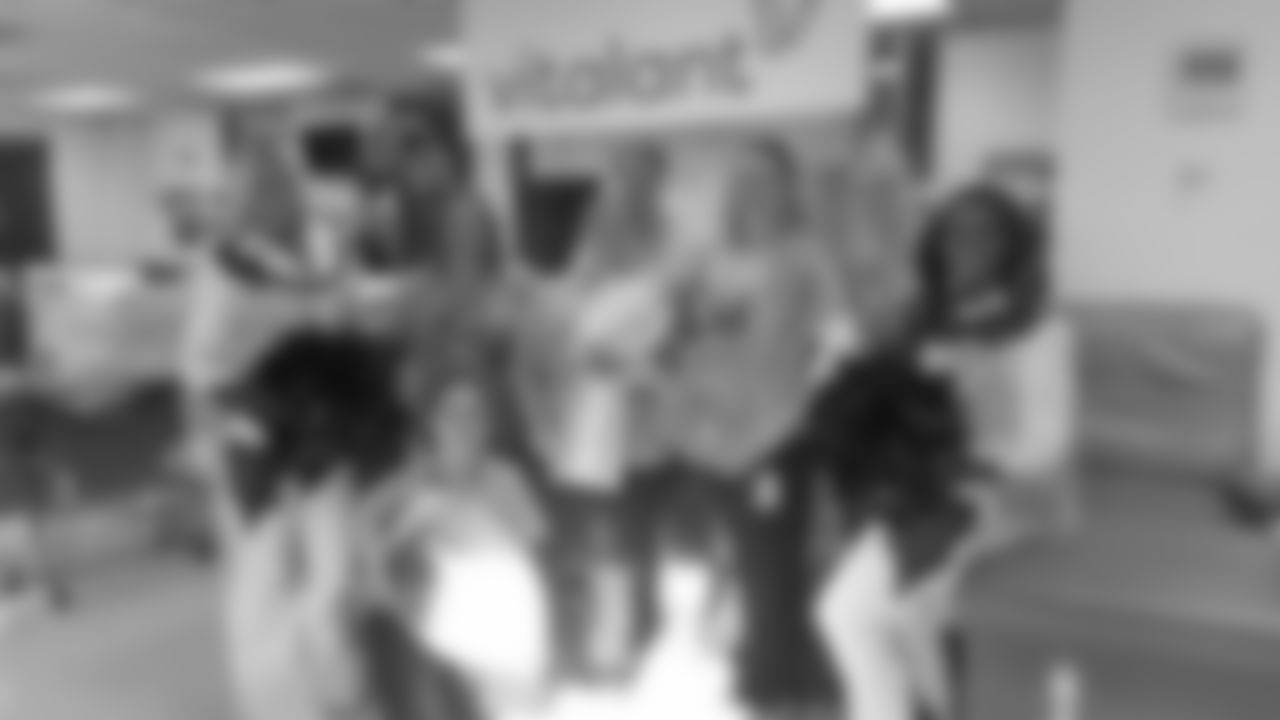 Volunteers pose for a photo with Denver Broncos Cheerleaders at Vitalant's Drive for Life 22 blood drive in Denver, Colorado on November 5, 2019.