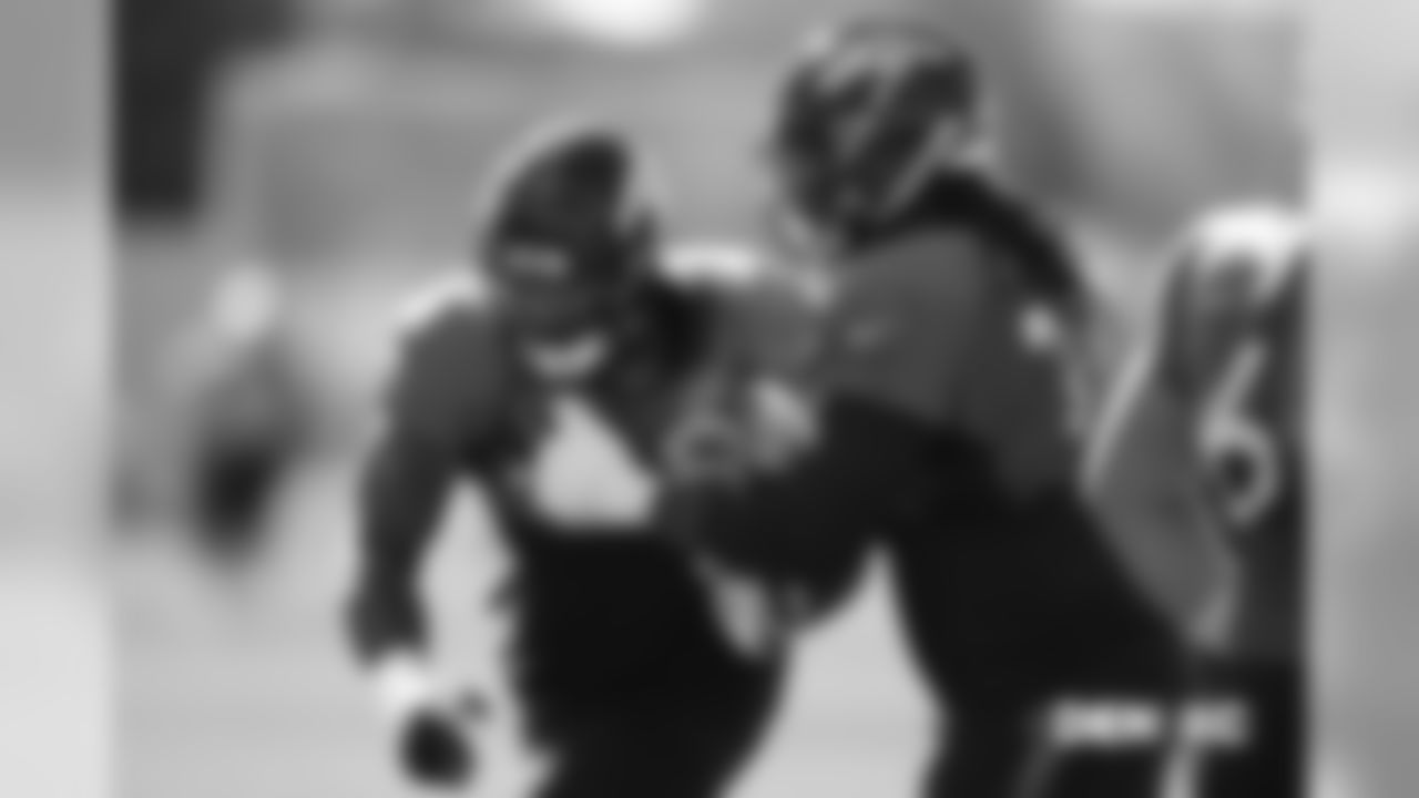Billy Turner works with Elijah Wilkinson during drills during practice at UCHealth Training Center in Centennial, CO, October 25, 2018.
Photo by Gabriel Christus