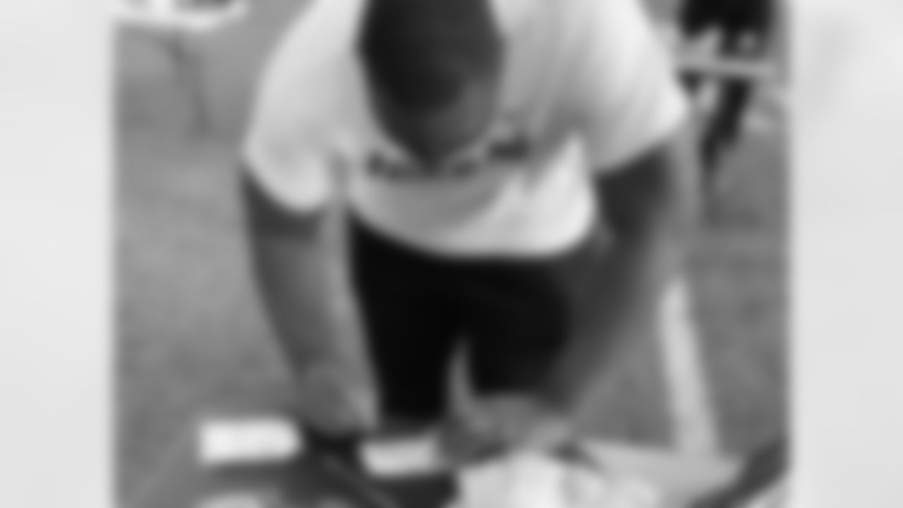 Shelby Harris helps put together hygiene kits for the homeless.