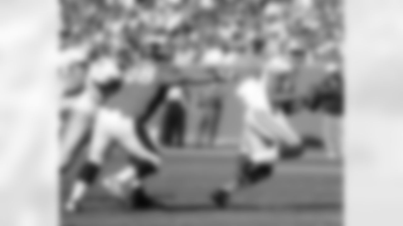 DT Sealver Siliga fights off a block