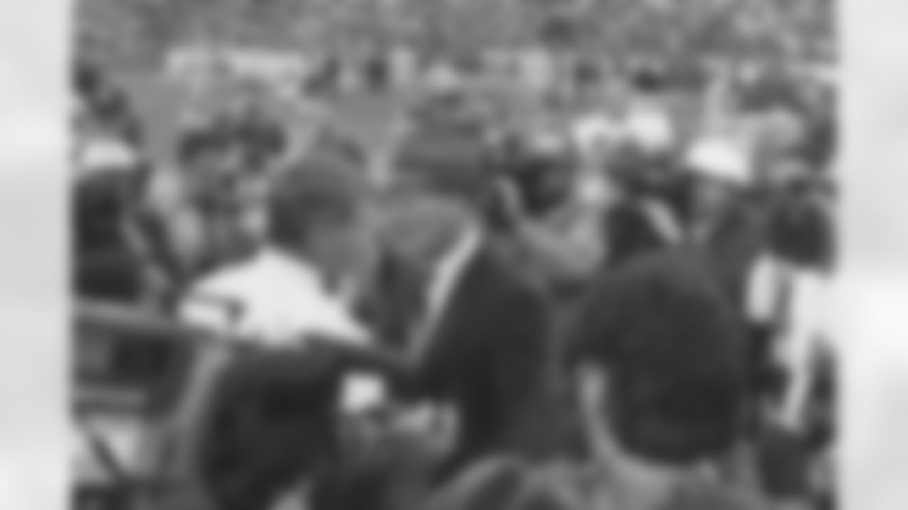 Cowboys coach Tom Landry congratulates coach Dan Reeves on his 50th victory (29-14) on October 5, 1986 against Dallas at Mile High Stadium.